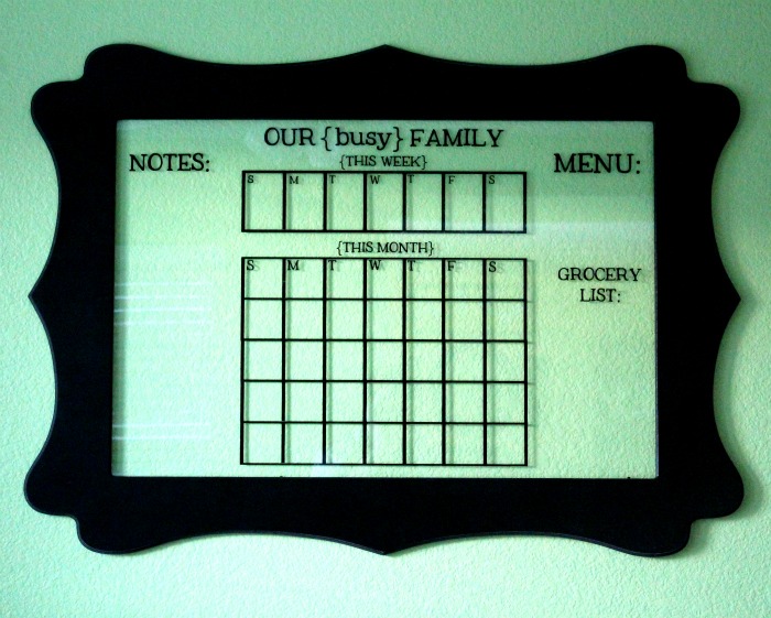 Glass dry erase calendar, a cute way for any busy family to get organized! { lilluna.com }