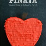 Teacher's Apple Piñata Tutorial on { lilluna.com } So cute and easy to make! Supplies include cardboard, red streamers, & brown paint!!