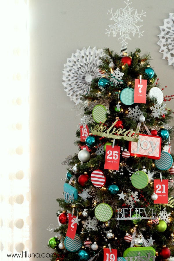 Advent Christmas Tree! The kids will love this! { lilluna.com } Bright & colorful and the kids get a little treat as they pull the numbers off!