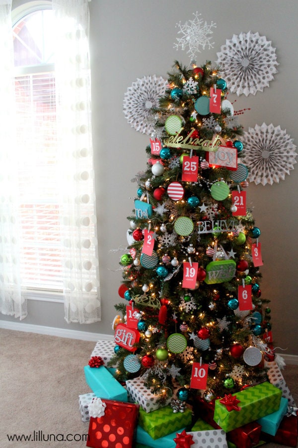 Advent Christmas Tree! The kids will love this! { lilluna.com } Bright & colorful and the kids get a little treat as they pull the numbers off!