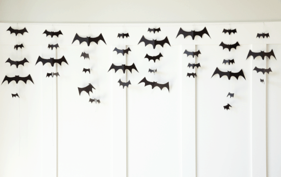 DIY Bat Garland - so easy and so spooky. Tutorial on { lilluna.com } Grab some cardstock, string, and scissors and you're set!