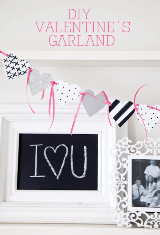 Easy DIY Valentine's Garland on { lilluna.com } Simple and cute! All you need is white scrapbook paper, a black marker, ribbon, and a hole punch!