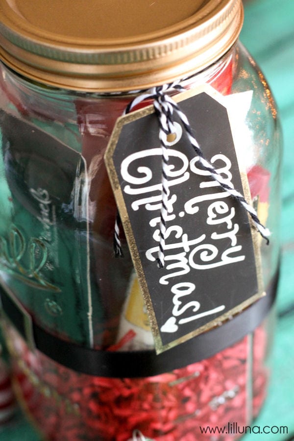 Super Cute and Simple Santa Jar Gift filled with favorite things - tutorial on { lilluna.com } Grab a jar, scrapbook paper, ribbon, grass paper and you're ready to fill!