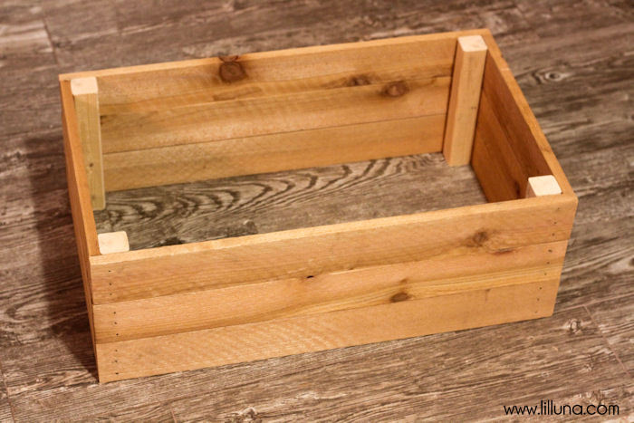 DIY Shoe Bin tutorial - the perfect place to store your shoes! { lilluna.com } Supplies include - boards, wood planks, nails, paint, and basic tools.