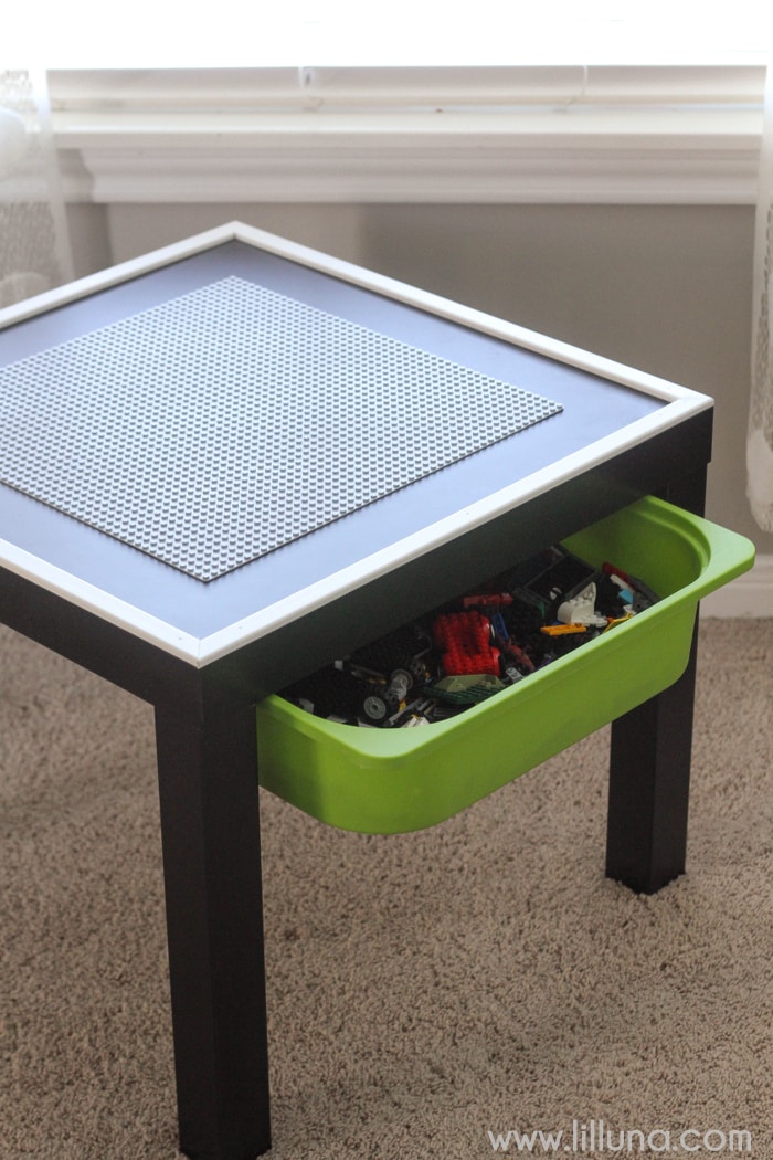 DIY Lego Table with storage bin underneath to hold all the extra legos and an edge to keep them from falling off! It's the perfect gift for the Lego Lover!
