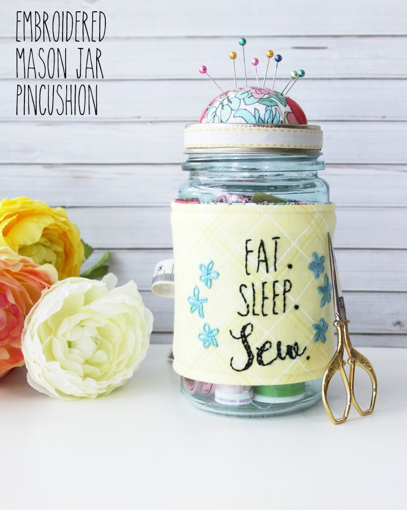 Easy Embroidered Mason Jar Pincushion tutorial - so cute and such a great gift idea for the avid sewer! Grab your fabric, fusible fleece, ribbon, stuffing, and a few more supplies and you're ready to make this adorable gift!