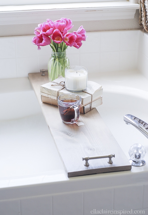 This easy DIY bathtub tray is perfect to hold your drink and your favorite book while you soak!