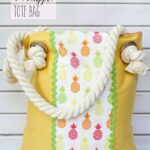 Easy Summer Pineapple Tote Bag - This cute bag is so easy to sew up and has all kinds of pockets for holding your keys and phone.